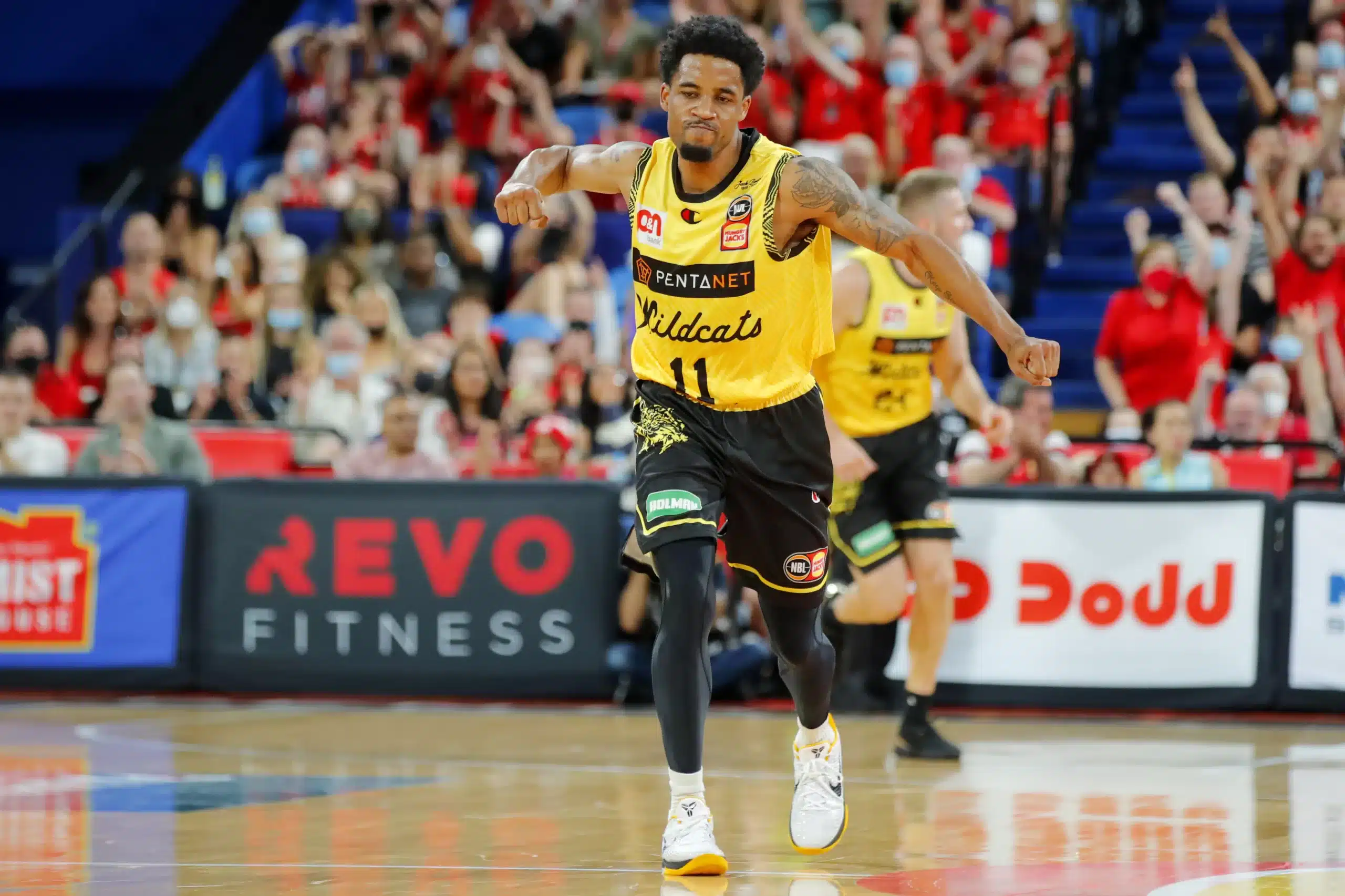 PERTH, AUSTRALIA - APRIL 16: Bryce Cotton of the Wildcats celebrates after making a three point shot during the round 20 NBL match between Perth Wildcats and Cairns Taipans at RAC Arena on April 16, 2022, in Perth, Australia. (Photo by James Worsfold/Getty Images)